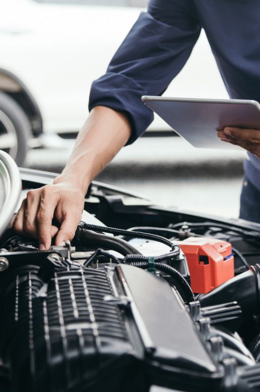 Automobile mechanic repairman hands repairing a car engine automotive workshop with a wrench, car service and maintenance,Repair service.